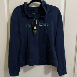 Womens bebe hooded jacket.  Size medium blue with sparkles